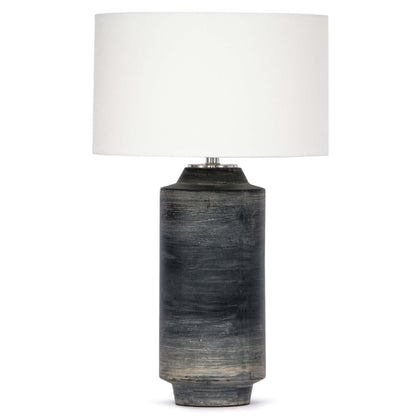 Dayton ceramic table lamp featuring a textured, time-worn ebony finish in a cylindrical silhouette, topped with a natural linen drum shade and polished nickel finial—blending industrial charm with refined design-1