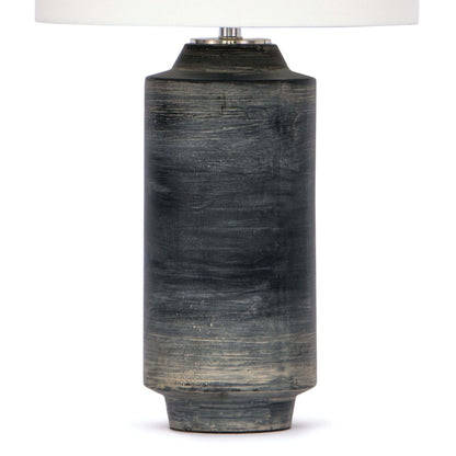 Dayton ceramic table lamp featuring a textured, time-worn ebony finish in a cylindrical silhouette, topped with a natural linen drum shade and polished nickel finial—blending industrial charm with refined design-3